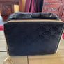Estee Lauder Vanity case in black with applique style design in the front and a nice bow style handle on top Image 3