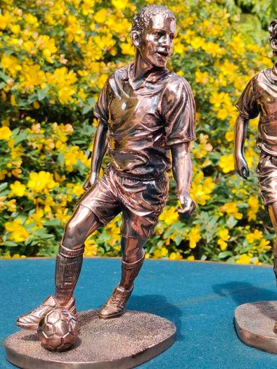 Two Gilded footballers