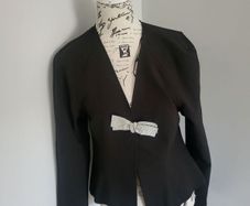 black jacket with bow