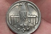 1935 Adolf Hitler fantasy 5 Reichsmark coin. These are collectible tokens or replicas, as Hitler never appeared on official circulating German coinage