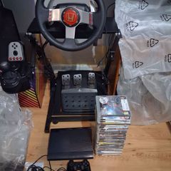 PlayStation 3 Super Slim 31 games/logitech g27 Bundle