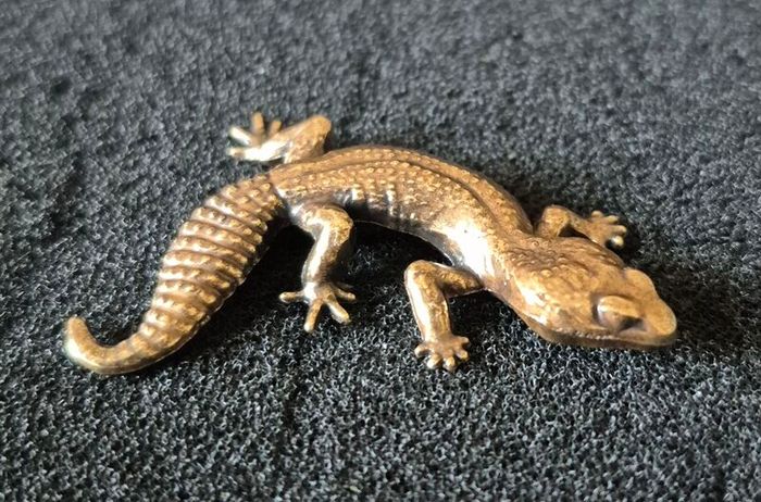 3 brass lizards.