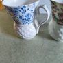 Set of 2 mugs decorative porcelain  fine bone china featuring a distinct textured, quilted or honeycomb base and intricate floral patterns. Image 9