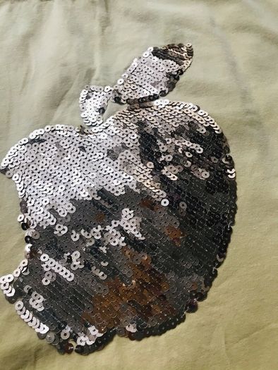cute yellow t-shirt.  The "apple" has golden sequins