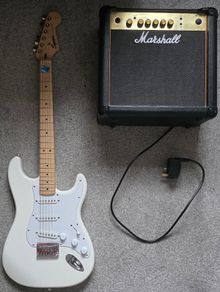 Squier Stratocaster electric guitar and Marshall MG15 amplifier