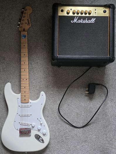 Squier Stratocaster electric guitar and Marshall MG15 amplifier
