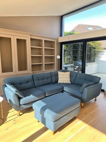 L-shaped sofa and footstool