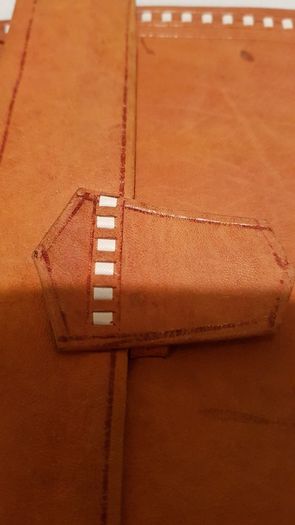 handcrafted made soft leather wallet,with designs ,, thank you,,was used,some wear and tear,,take as is ..