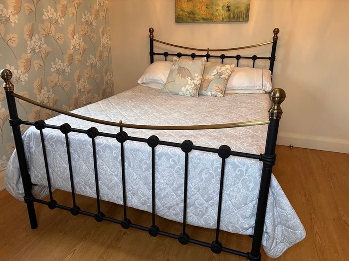 Black metal and brass double bed frame c/w mattress