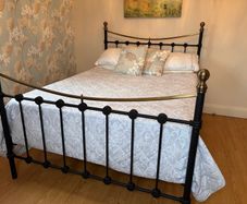 Black metal and brass double bed frame c/w mattress