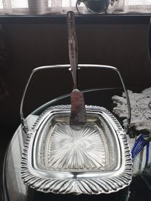 Vintage English glass butter dish with chrome finish, glass insert and butter knife.