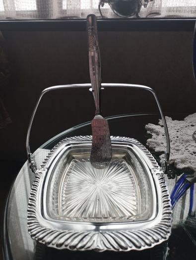 Vintage English glass butter dish with chrome finish, glass insert and butter knife.