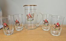 Vintage jug and four glasses with hunt scene