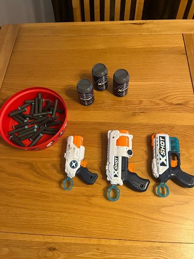 3 Xshot guns and targets and bullets