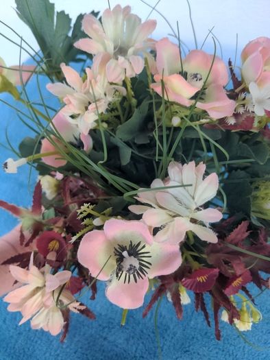 Small artificial bouquet of flowers