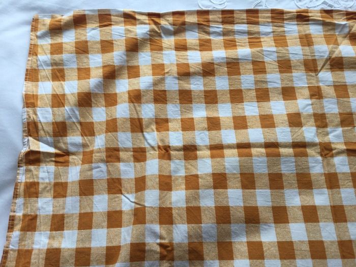 Orange and white gingham tablecloth