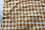 Orange and white gingham tablecloth