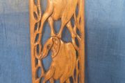 Hand-carved wooden elephant wall hanging