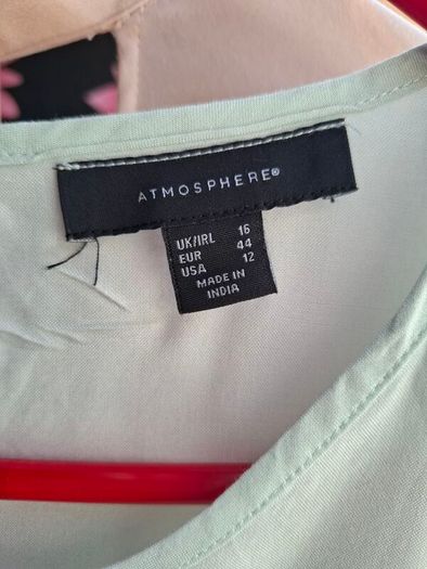 Mint green top.
