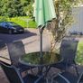 Glass table and 4 chairs. Can have umbrella and stand if want Image 2