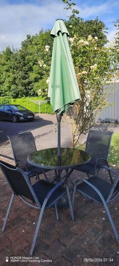 Glass table and 4 chairs. Can have umbrella and stand if want
