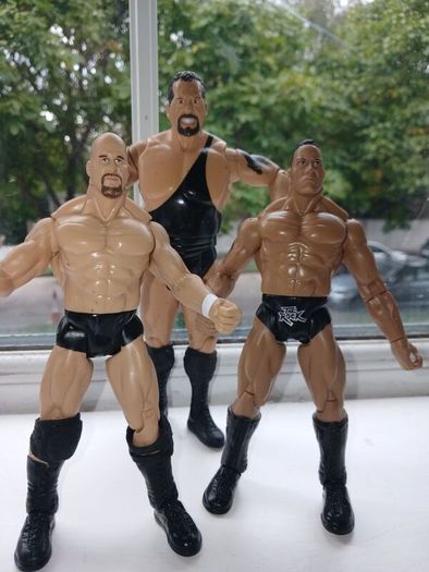 Westlers The Rock, Stone Cold and Big Show