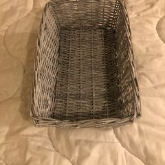 Grey wicker storage basket