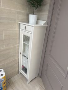 Bathroom storage in white.