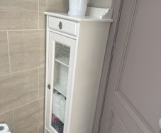 Bathroom storage in white.