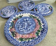 Vintage French Majolica Putti pottery plate, Barbotine, cherubs, musical, musicians, angles, pre loved, hanging, glass glazed, floral, round. --large plate  40.00 euro 27CM. diamter. -- small one 20.00 euro each . 14.5 CM. diamter    all set of 4 for  90.