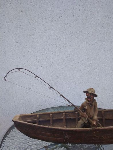 Antique fisherman and boat