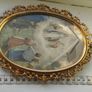 An antique-style painting set in an ornate, gold-toned frame. Image 4
