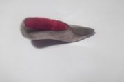 a vintage solid silver pin cushion in the shape of a shoe