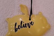 Yellow hanging plaque