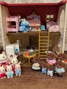 Sylvanian cottage and rainbow nursery bus with extras