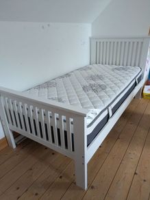 Single wooden bed with mattress