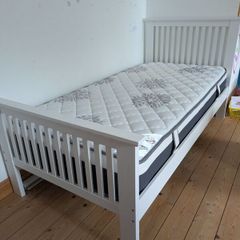 Single wooden bed with mattress