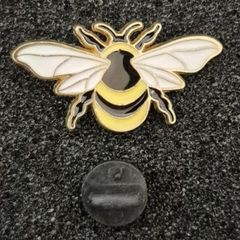 Bee ,  pin back badge.