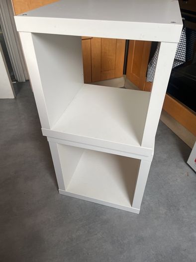 2 white storage units or bedside tables