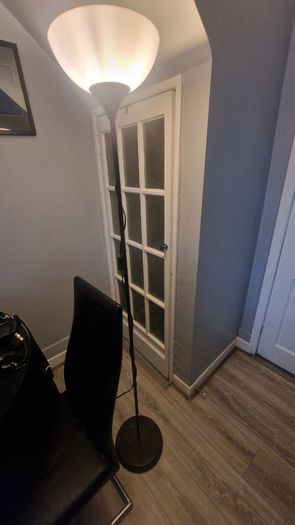 Black floor lamp with white uplighter shade