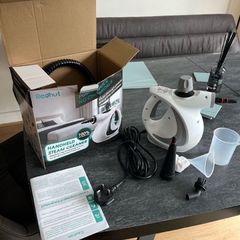 Hand held steamer