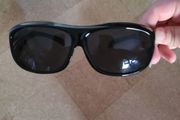 Sunglasses fits over prescription glasses