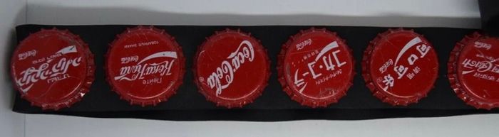 Coca Cola belt with cola caps from all over the world