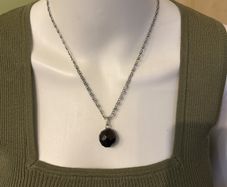 Chain necklace with black stone pendant