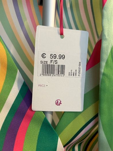Brand new dress still with tag. Free size , will fit up to size 12