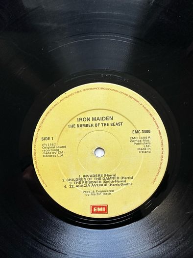 Iron Maiden. Irish release The number of the beast. Outer sleeve is vg+ inner sleeve is vg with some small age marks on 1 side. Vinyl is vg with some light wispy scuff marks and writing on 1 label