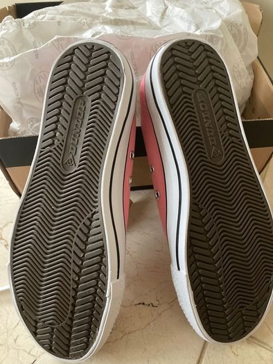 Brand new never worn size 4 pink canvas Dunlop shoes.