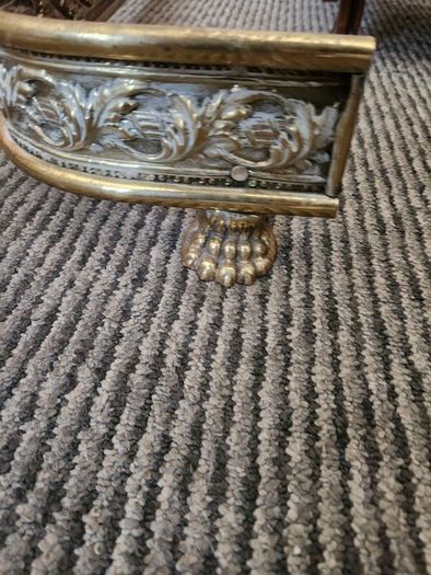 19 th Cent fender on claw feet. Polished