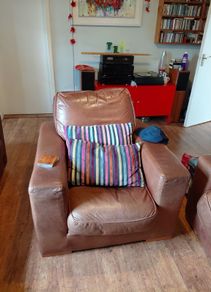 Two seater brown leather sofa and one chair