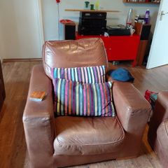 Two seater brown leather sofa and one chair